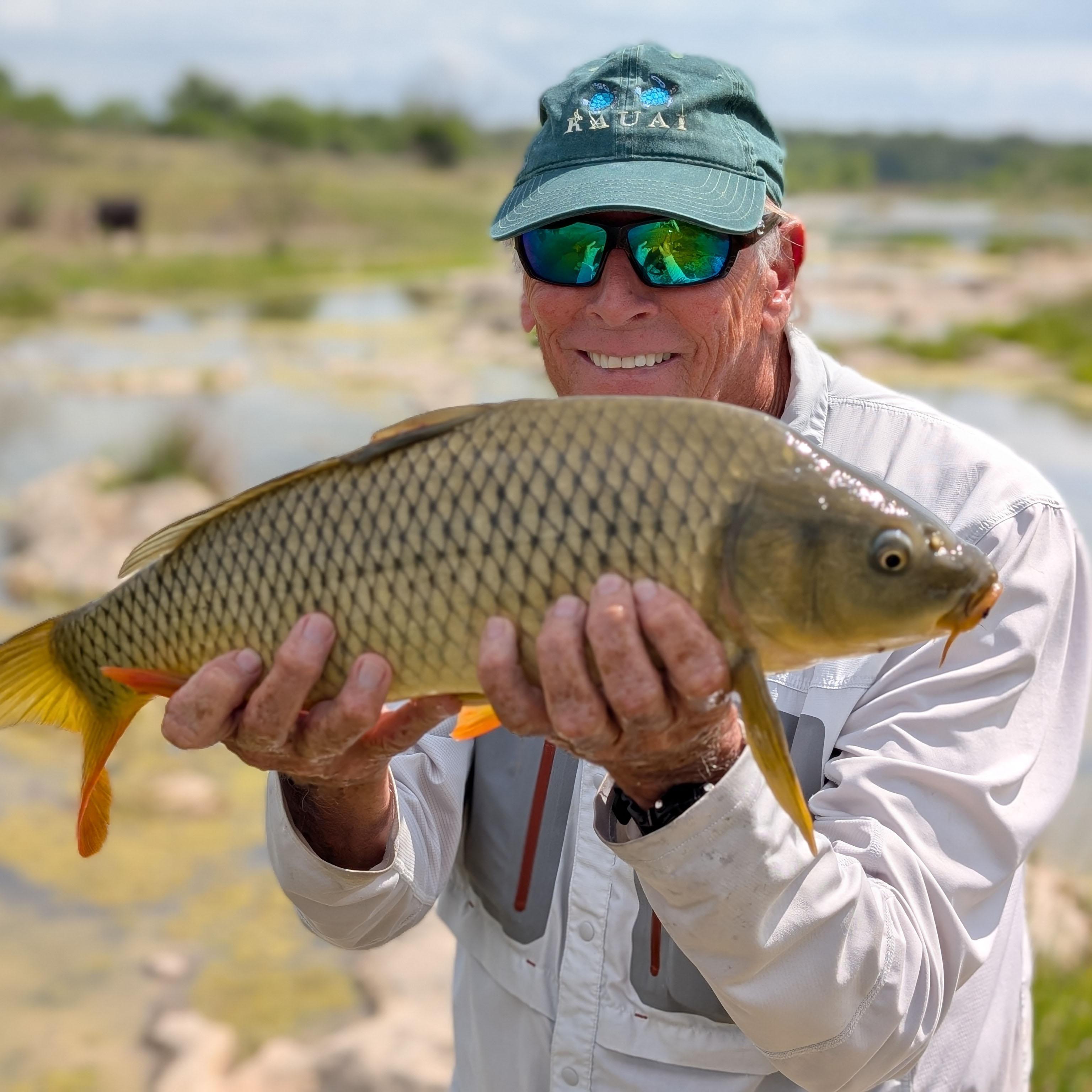 Dale holding a large common carp.